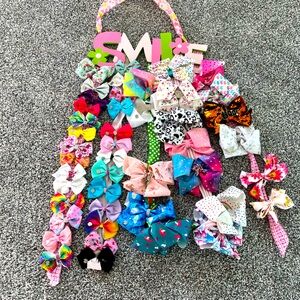 Lot of 43 hair bows with “Smile” hanger
